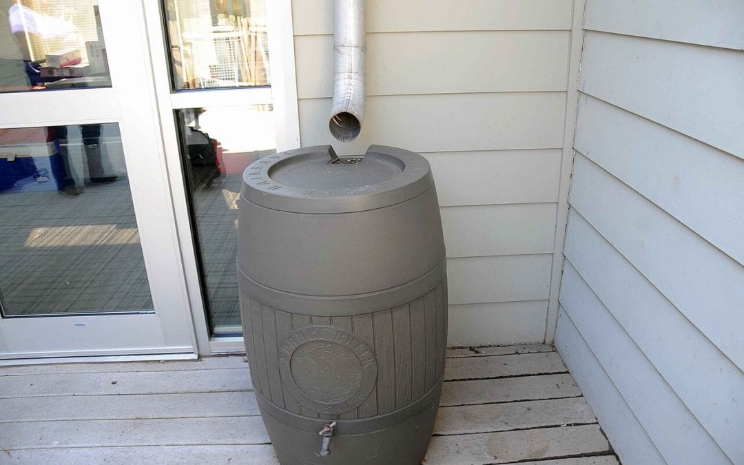 save water at home by using a rain barrel to catch water from the roof